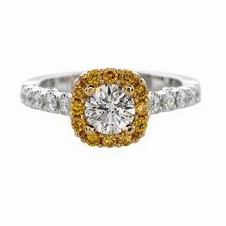 DIAMOND RING WITH FANCY YELLOW DIAMOND BEZEL AND DIAMONDS DOWN SHANK Evening Glow