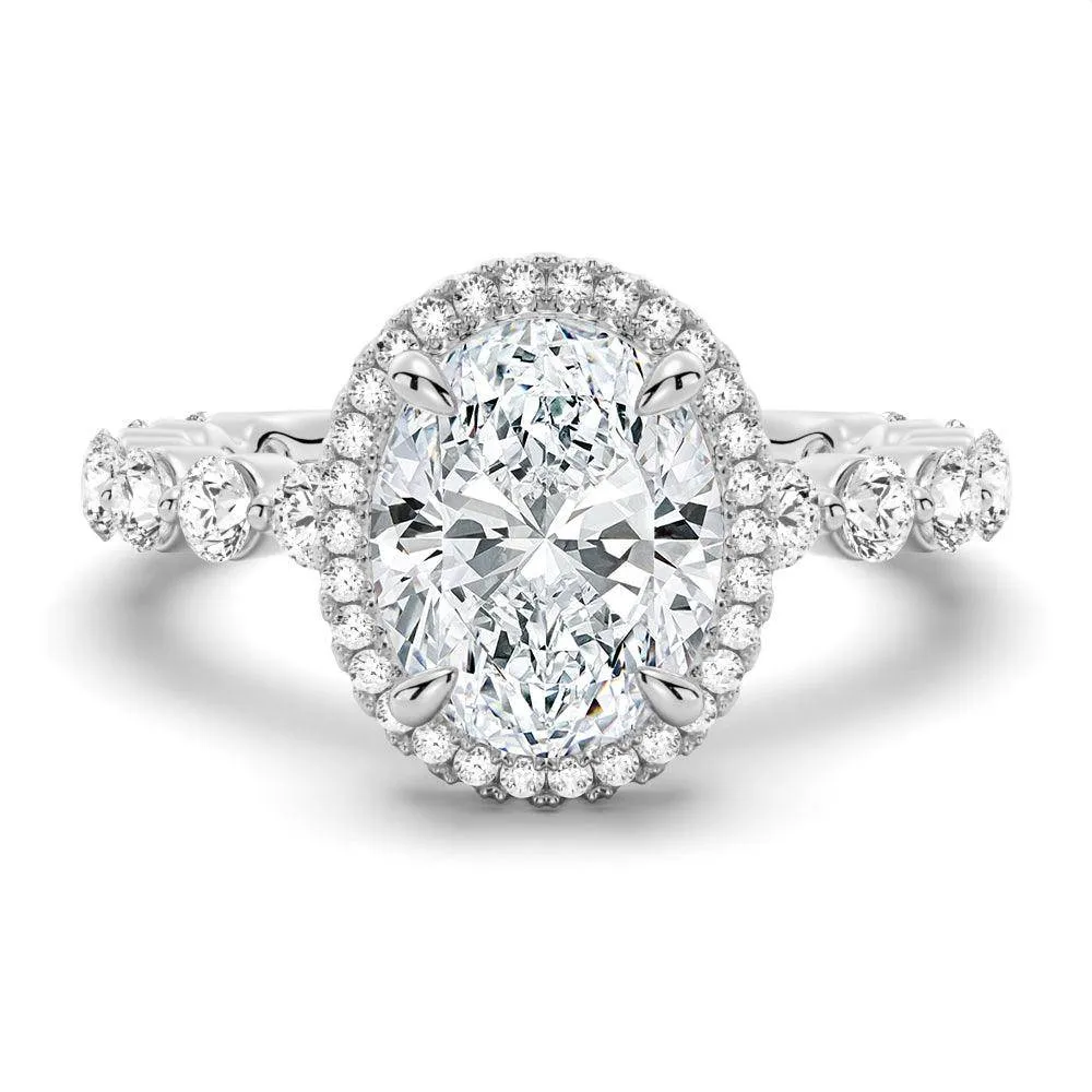 Simple Elegance Weekend Accent Oval Halo with Pav?? Shared Prong Band Moissanite Engagement Ring