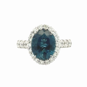 Layered Spark PLATINUM OVAL BLUE TOPAZ HALO RING