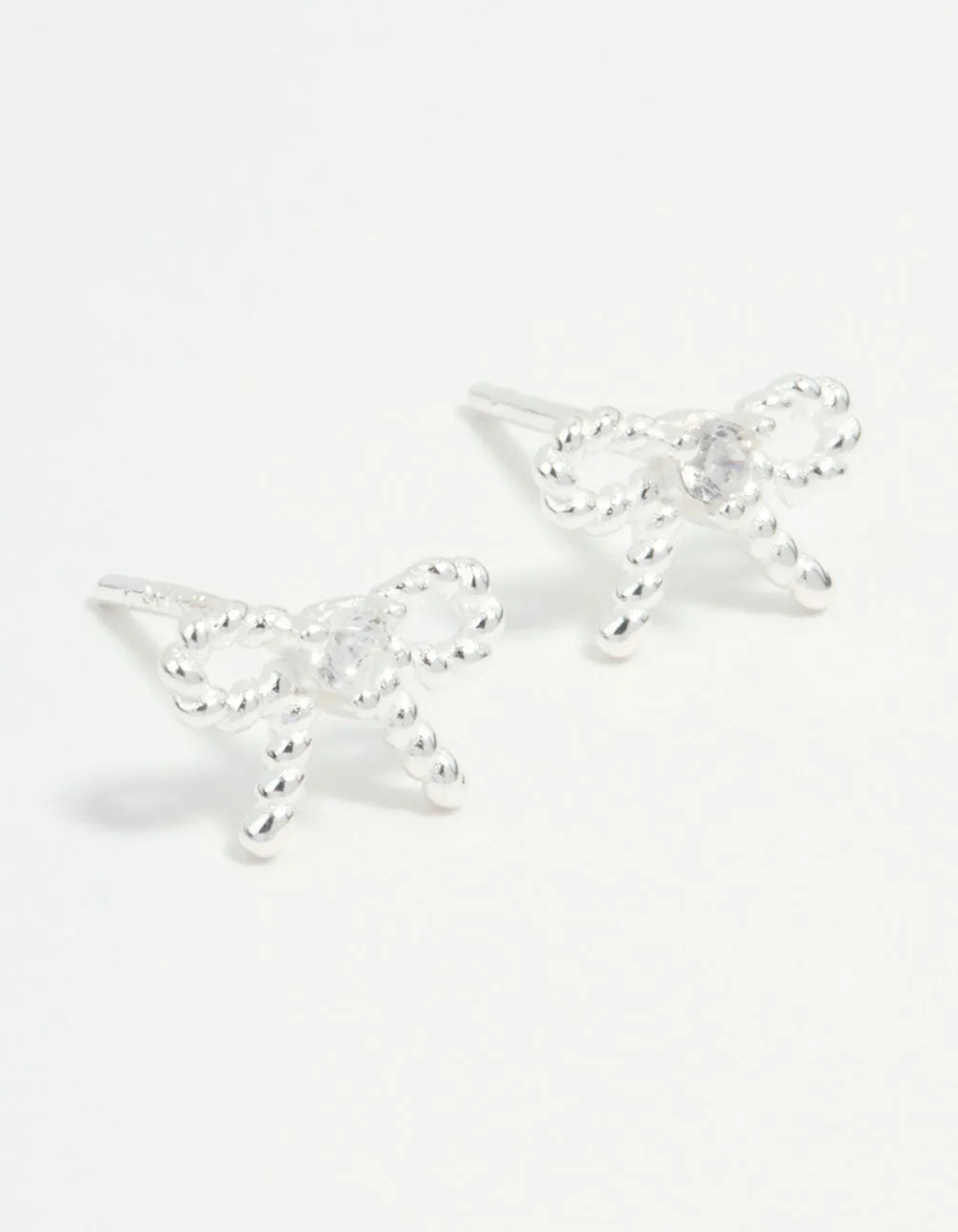 Sterling Silver Textured Bow Stud Earrings Safe product